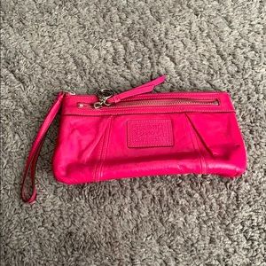 Pink Coach poppy wristlet with 2 zipper pockets
